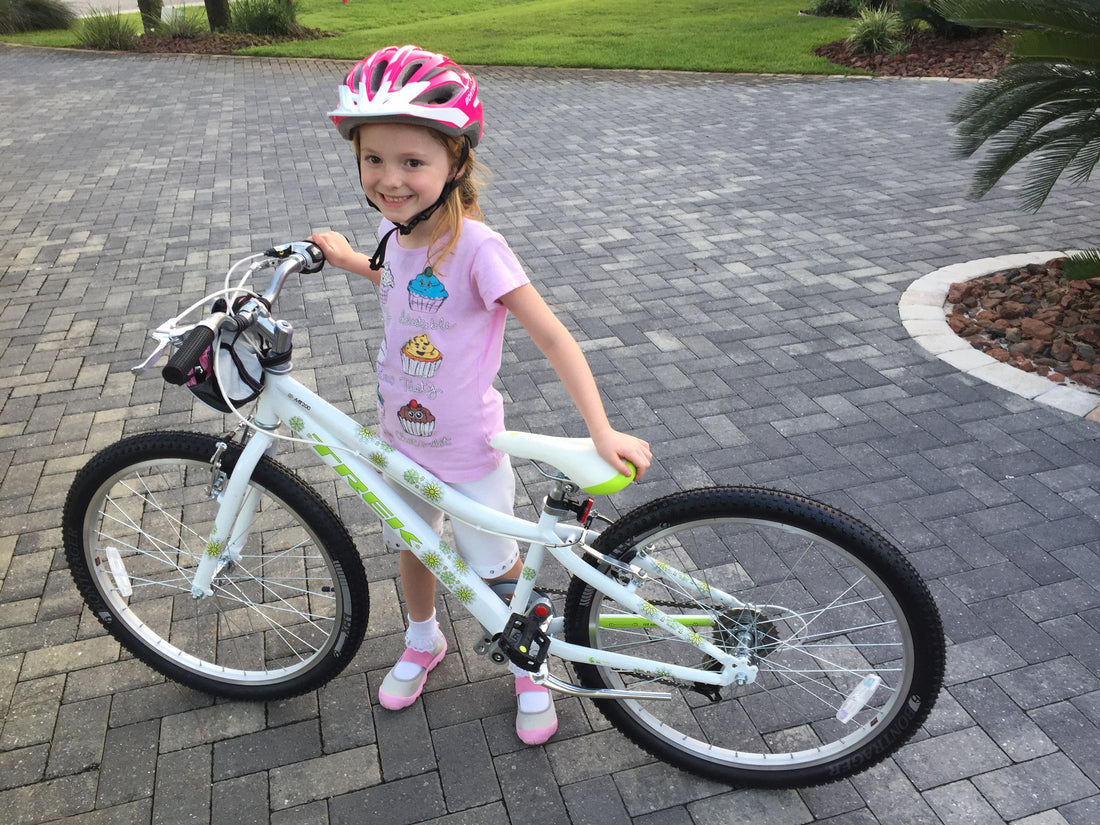 young girl with bicycle