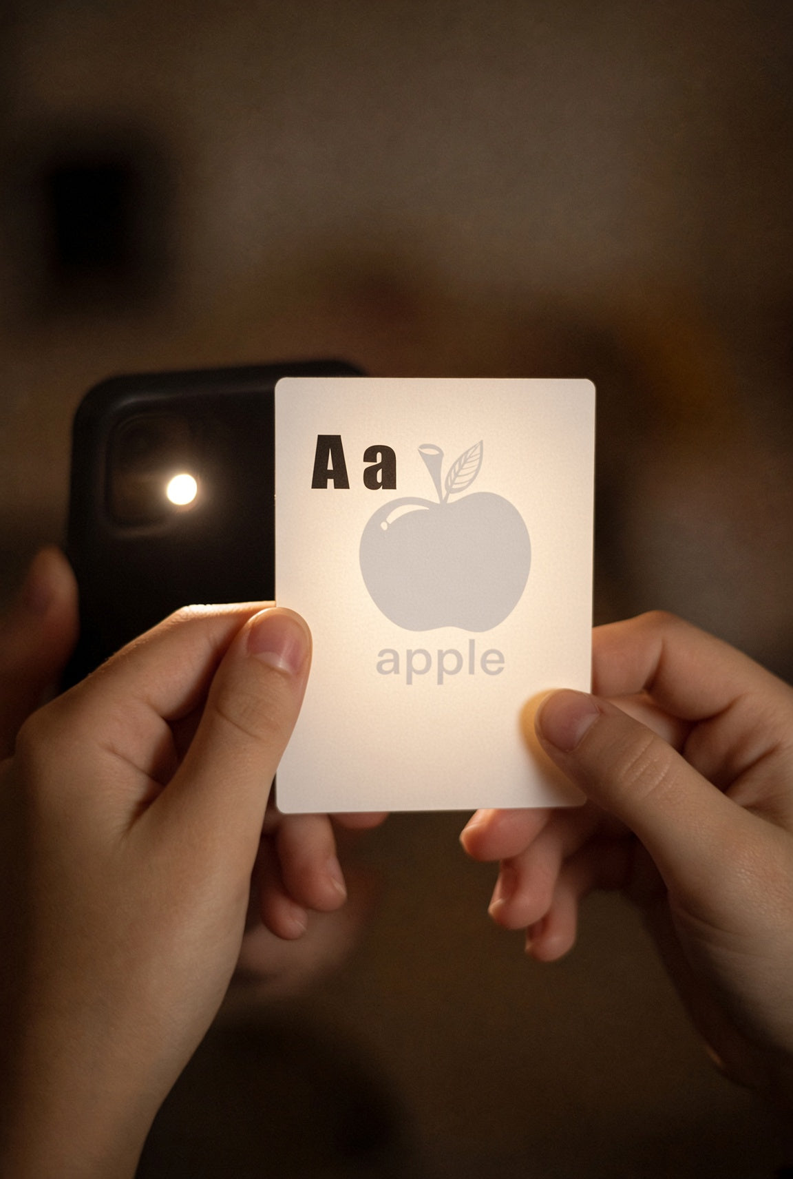 shadow card A a beginning sound held up to a phone flashlight